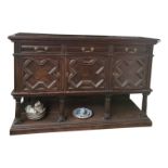 A Jacobean style oak sideboard, height 99cm, width 152cm.