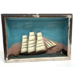 A late Victorian ship diorama, depicting a three masted schooner and tender off a lighthouse,