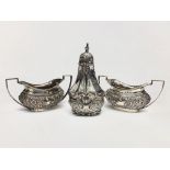 A pair of silver open salts with repousse decoration, together with a silver pepper, 3.7oz.
