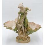 A Royal Dux porcelain centrepiece, modelled as an art nouveau lady beside two clam shells,