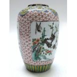 A Chinese famille verte porcelain vase, 19th century, height 20cm.