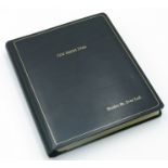 A ring bound photograph album 25x22cm, containing forty large, black and white photographs,