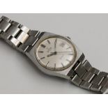 A gentleman's stainless steel cased Omega Automatic Geneve wristwatch with black baton numerals and