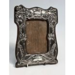 An Edwardian floral Art Nouveau silver mounted frame by William Aitken, Birmingham 1905. 23 x 17.