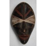 An African wooden Dan tribal mask, Cote D'Ivoire, height 27cm width 17cm.