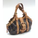 A Louis Vuitton monogram limited edition Theda PM handbag, cow hide leather handle,