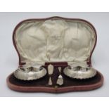 A pair of silver shell butters and knives in fitted case retailed by Rob Ashworth Company Ltd,