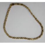 An 18ct gold fancy link necklace, 28.