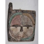 An African Kwele tribal window shutter, Gabon, height 32 cm width 22 cm.