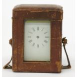 A French carriage timepiece, with brass frame, in outer leather carry case,