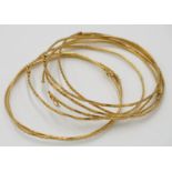 Seven Asian very high purity gold bangles, 31 g, sold with a receipt from a Singapore jeweller,