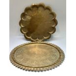 An Oriental cusped circular brass tray, with engraved decoration,