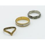 An 18ct gold band, 4.5g, together with a 9ct wishbone ring and a silver ring.