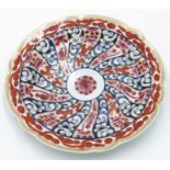 A Worcester porcelain dessert plate, 18th Century, painted in iron red,