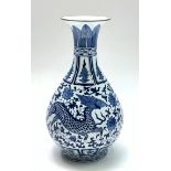 A Chinese blue and white porcelain vase, decorated with a mythical beast, height 31cm.