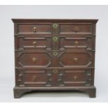 An oak chest of drawers, late 17th century, with four long geometric graduated drawers,