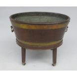 A Georgian mahogany oval wine cooler on stand,