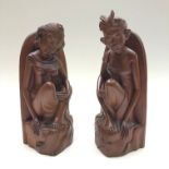 A pair of Burmese carved hardwood bookends, height 32cm.