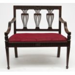 An Edwardian mahogany sofa,