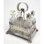 A Walker and Hall silver six section cruet with pierced galleries and ball feet,