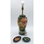 A Moorcroft anemone pattern table lamp, of baluster shape, green ground,