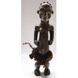 An African wooden Galoa tribal maternity figure, Gabon, height 71cm width 18cm.