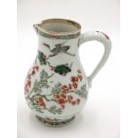 A Chinese famille verte porcelain jug, 18th century, height 18cm.