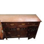 An Arts and Crafts mahogany sideboard,