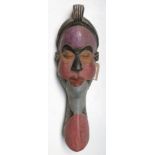 An African wooden Pende tribal polychrome mask, Congo, height 51cm width 16cm.