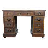 A mahogany pedestal desk, early 19th century, with a rectangular leather inset top,