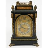An ebonised and gilt metal mounted musical bracket clock,