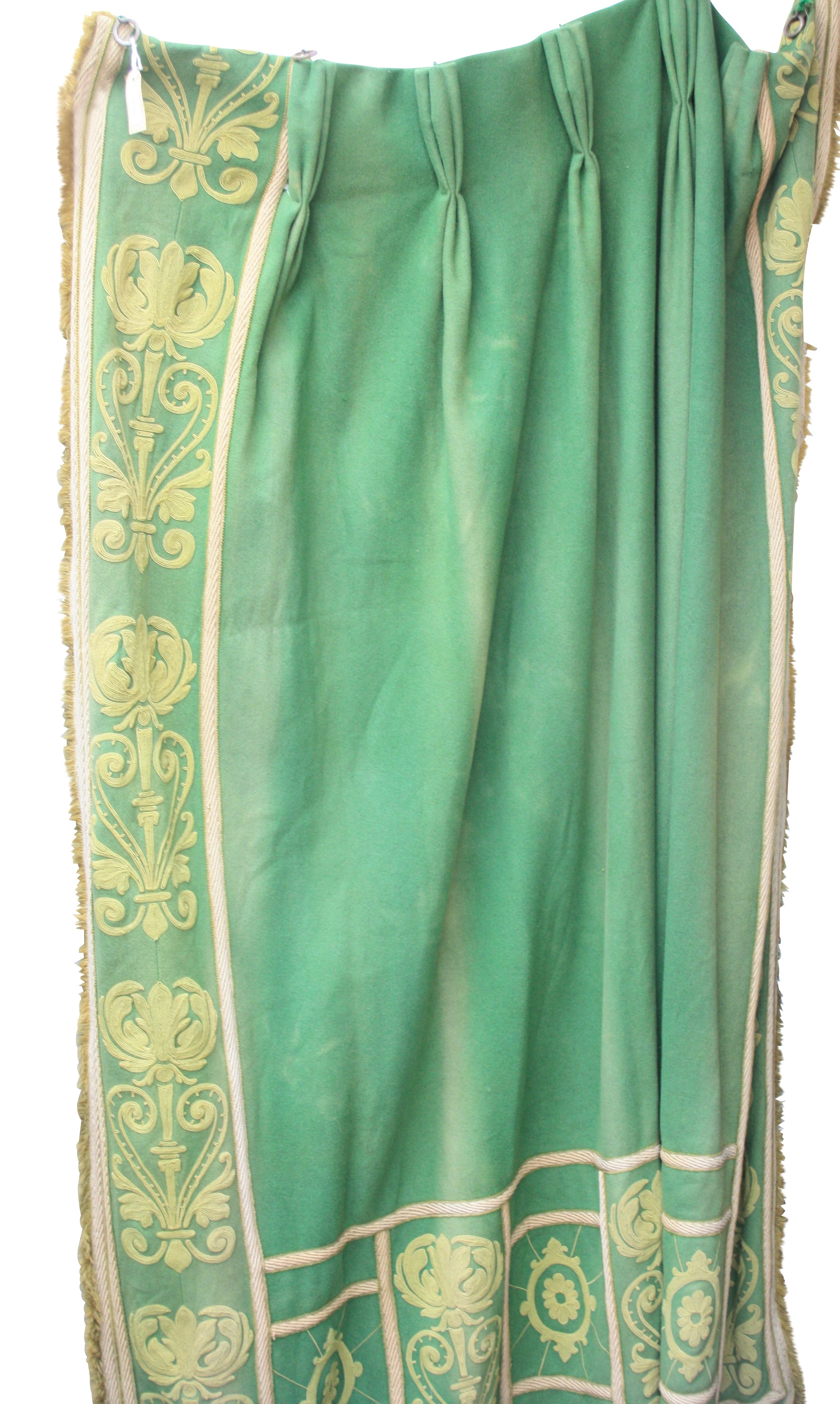 A green baize door hanging/curtain, with embroidered stylised floral decoration, height 210cm.