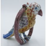 A Delft pottery figure of a parrot on a ring perch, possibly by Adrianus Kocks,