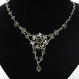 An Arts and Crafts silver necklace set with citrine,