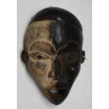 An African wooden Bakongo tribal mask, Congo, height 22cm width 15.5cm.