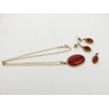 A carnelian 9ct gold mounted pendant and chain together with a pair of matching earrings and a