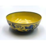 A Chinese yellow ground porcelain bowl, with dragons and cloud scrolls, Zhengde six character mark,