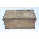 A Victorian oak chest, with a rising lid with moulded edge and base,