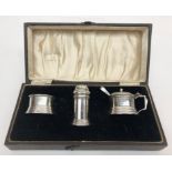 A silver three piece cruet in Art Deco style, cased.