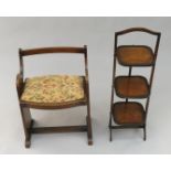 A three tier walnut folding cake stand, height 89cm and an oak piano stool.