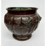 A Japanese bronze jardiniere, cast in relief with birds on branches, height 25cm, diameter 32cm.