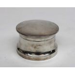 A plain filled silver powder bowl and cover.