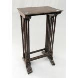 A nest of three mahogany tables, on ring turned legs, height 88cm, width 44cm.