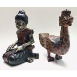 A Balinese carved wood figure of a stylised painted duck, height 40cm,
