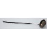 A Georgian silver toddy ladle set a gold coin with twisted baleen handle,