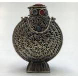 A Tibetan white metal snuff bottle, height 5.5cm.