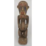 A Songye tribal two headed maternity figure, Congo, height 70cm.