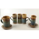 Three large Robin Welch Pottery cylindrical mugs, one chipped, height 18cm,