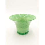 A Continental green marbled glass bowl, of flared form on indented foot, height 15cm, diameter 21cm.