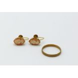 A 22ct gold band, 2.2g and a pair of 9ct mounted cameo earrings.